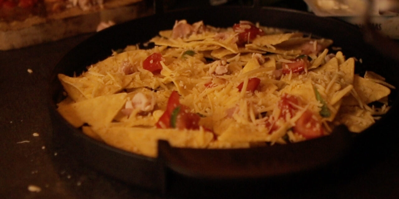loaded nacho from tortilla chips on BBQ