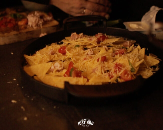 loaded nacho from tortilla chips on BBQ
